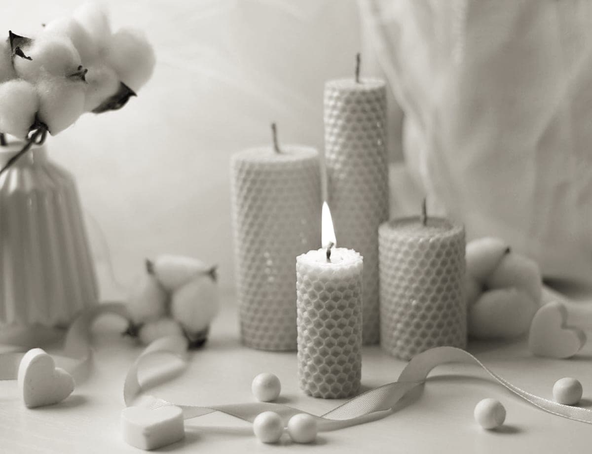 Handmade candles burning on a table